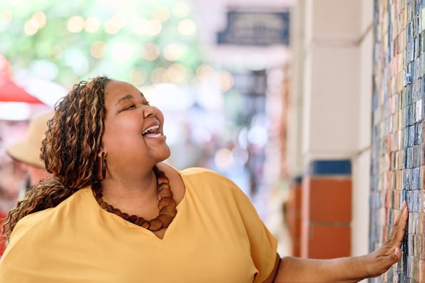 Jenita Lawal discovers mosaic tiles at Greenmarket Square in Cape Town, South Africa — a candid moment captured during a personal brand photo shoot in the city's historic CBD.
