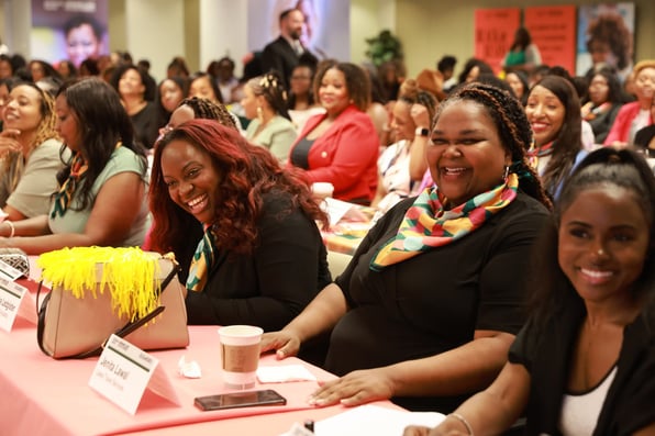 Jenita Lawal (center, nameplate) at the Goldman Sachs One Million Black Women: Black in Business graduation ceremony.